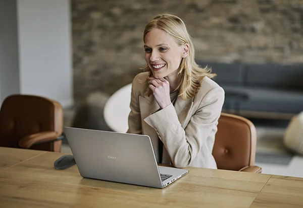 Young Businesswoman Working From Wooden Table