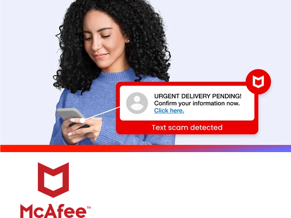 A person looking at their smartphone with a McAfee pop-up graphic that reads text scam detected.