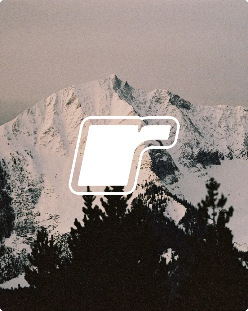 r logo on snowy mountain