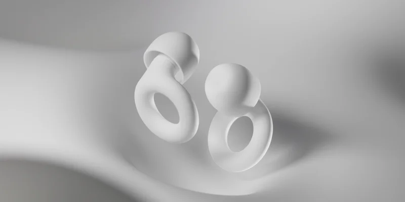 A pair of White Quiet 2 earplugs.
