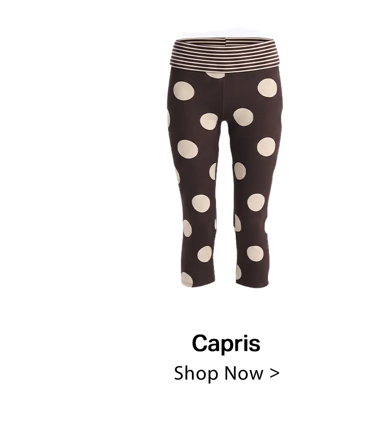 Dark brown capri pants displaying large cream polka dots and a horizontally striped waistband. Shop our women's stylish capri collection.