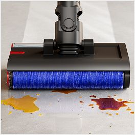Close-up of the Dyson PencilWash cleaner head as it cleans wet and dry debris