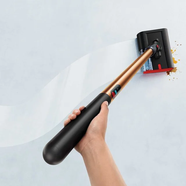 A person effortlessly cleans with the Dyson PencilWash wet cleaner