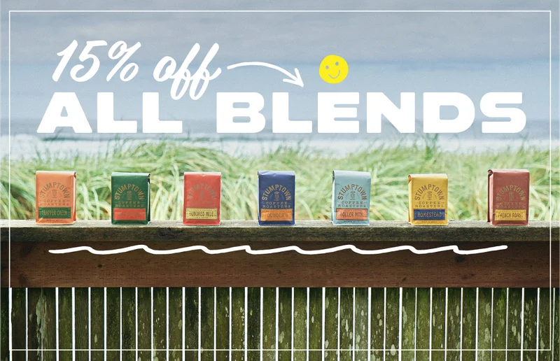 Photo of Stumptown coffee bags with the ocean in the background. Caption: 15% Off All Blends