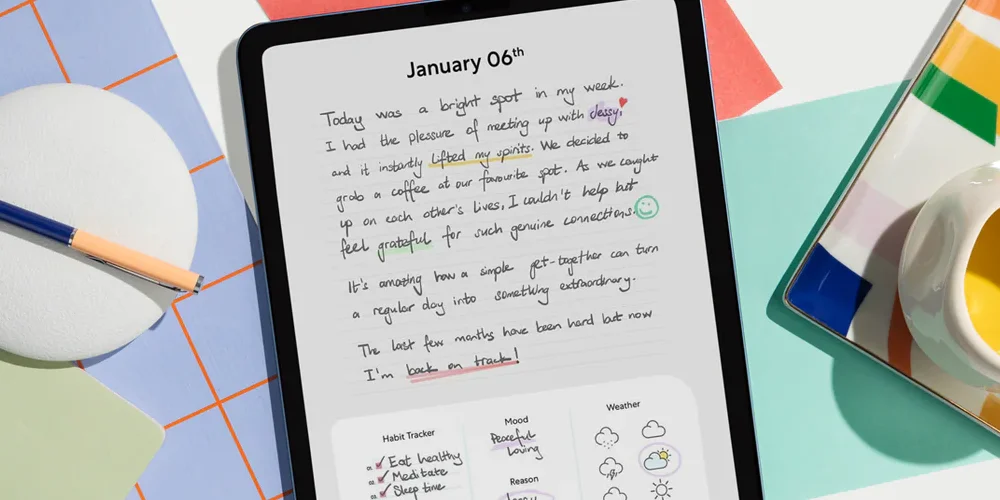 Image of an iPad with an open journal page and handwritten text on it.