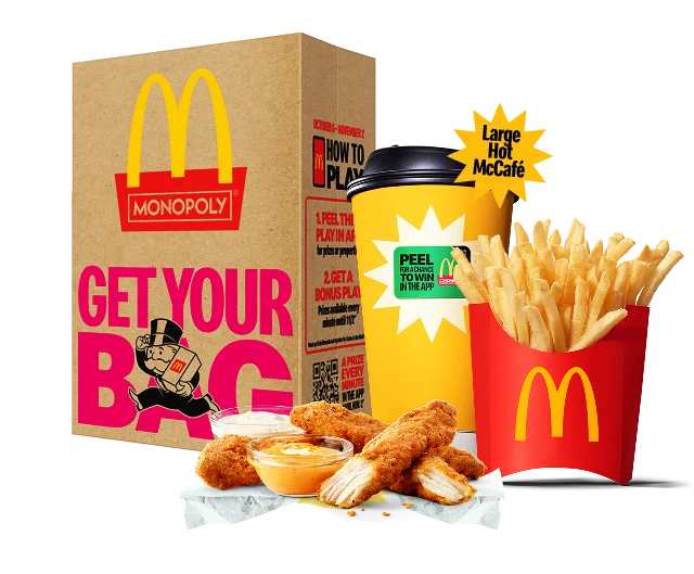 Image of 4 piece McCrispy Strips, Medium Fries, and a Large Hot McCafé in front of a McDonald’s bag.