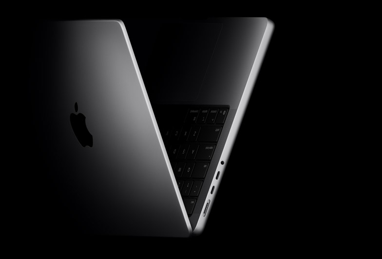 MacBook Pro positioned into the shape of a V, referencing the M5 chip