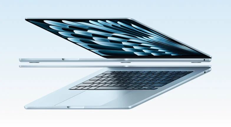 Two open MacBook Air laptops in sky blue color forming arrow shape, emphasizing narrow profile
