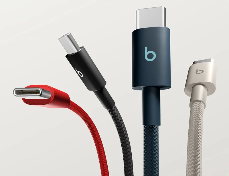 Beats Cable in Nitro Navy plugged into an iPhone laying on a table.