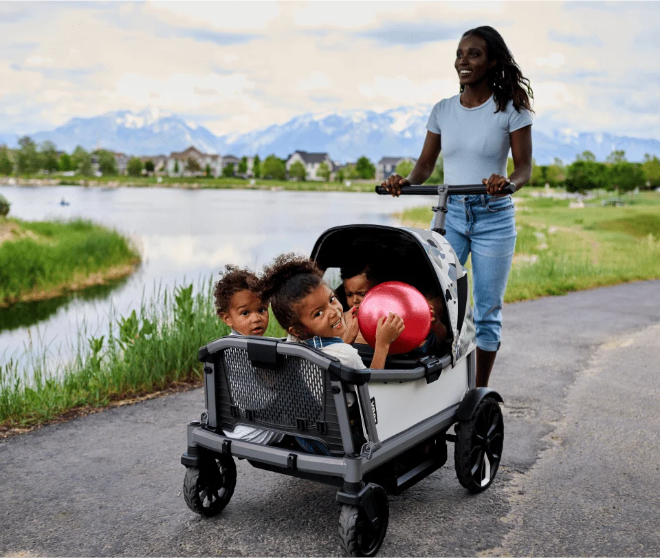 Cruiser City XL being pushed on a paved path by a lake
