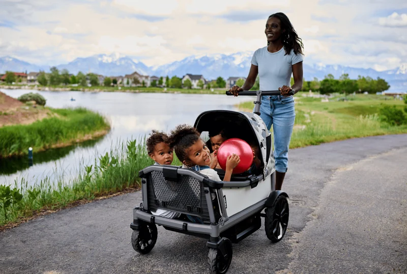 Cruiser City XL being pushed on a paved path by a lake