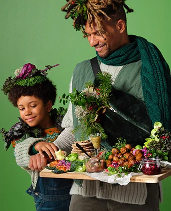 Adult and child enjoying a buffet board