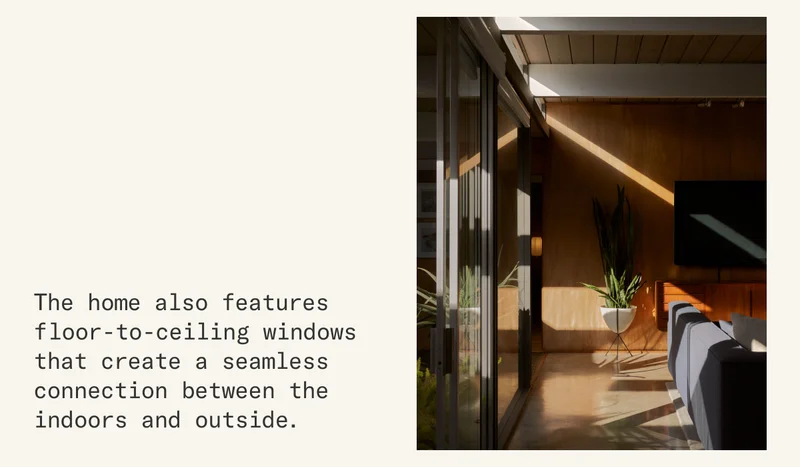 Floor-to-ceiling windows create a seamless connection between the indoors and outside.