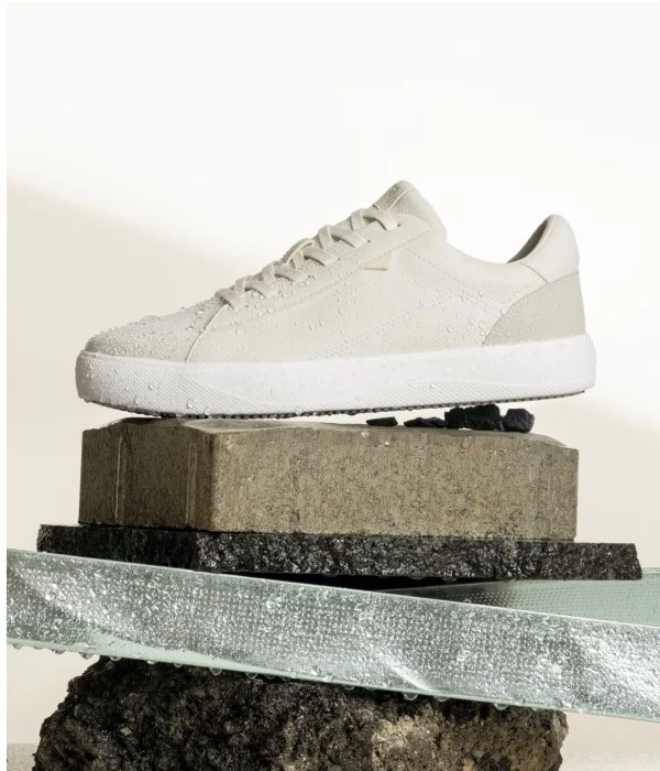 Graphic image of the Soho Sneaker in Ivory White on Dune Beige.