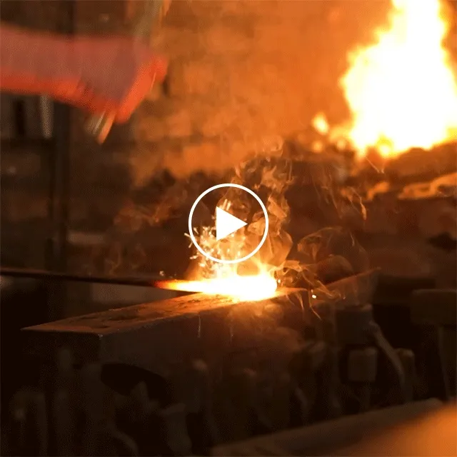 Sparks fly as master blacksmith John Fuller works in Dollywood's Blacksmith & Foundry.