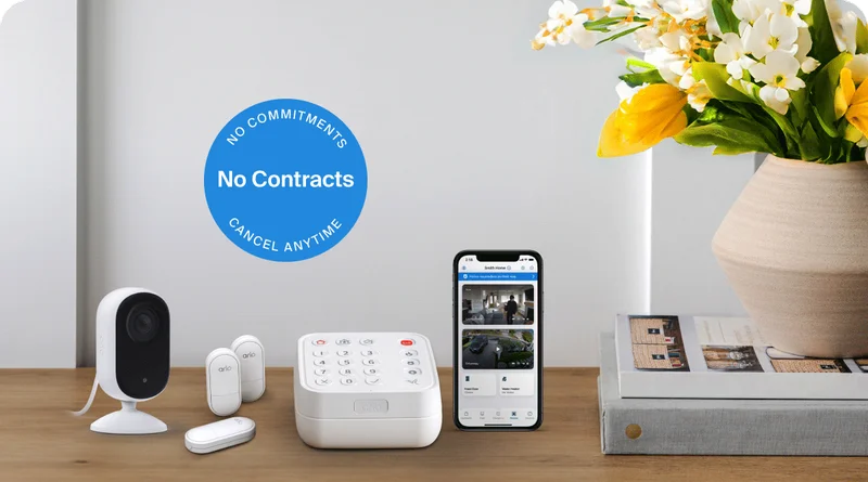 No commitments. No contracts. Cancel anytime. Arlo Home Security System next to an Arlo Indoor Security Camera and a phone showing a simulated screen image of Arlo Secure.