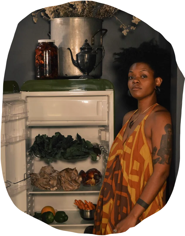 chef jas in hotel room with vegetables and ingredients in the mini fridge