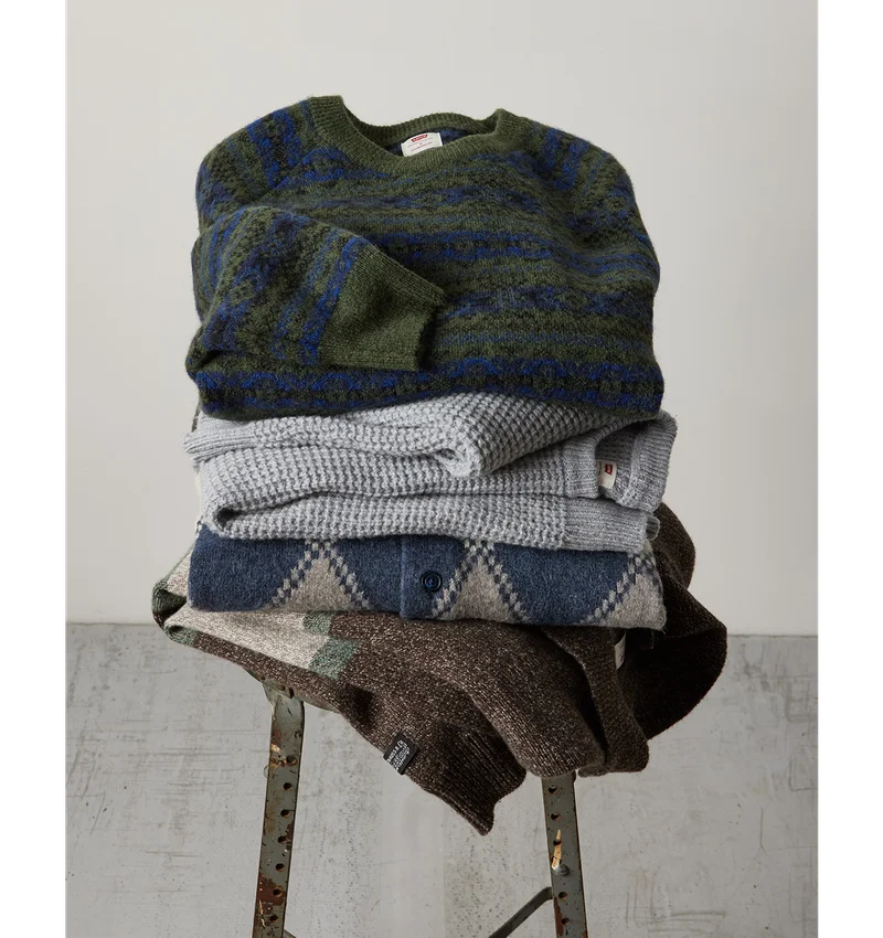 Stack of sweaters on a chair
