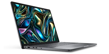 Side view of a Dell laptop computer on a dark gray                                                 background.