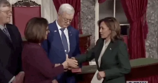 GIF of senator's husband refusing to shake Kamala Harris' hand