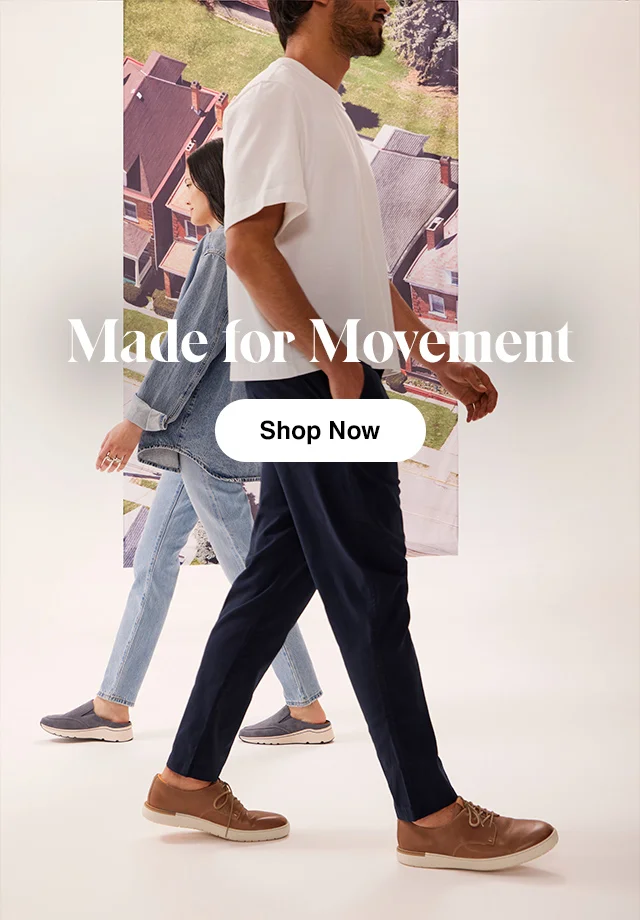 Woman walking in the background wearing denim and the Navy Trixie Slip-On and man in the foreground wearing a T-shirt and the Fossil Taupe Dash Derby. Shop All Shoes.