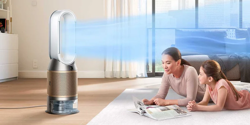 Family sitting in front of Dyson Purifier Humidify+Cool Formaldehyde projecting purified air