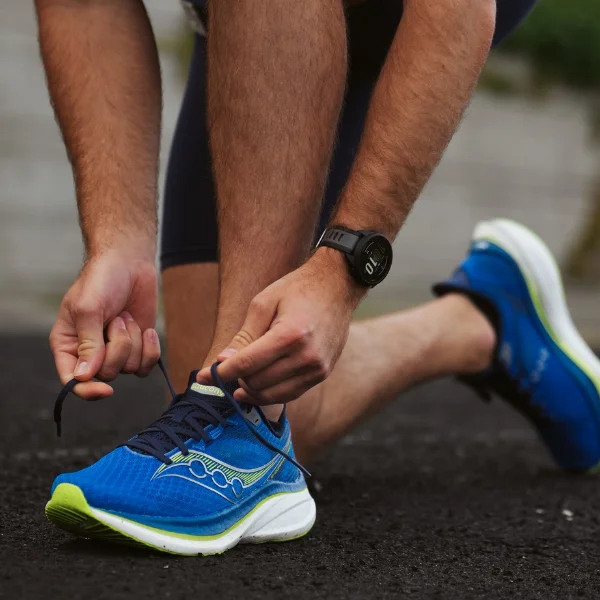 Man tying running shoes