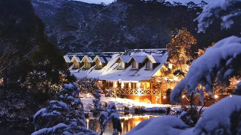 Image description: Exterior of Peppers Cradle Mountain Lodge at dusk.