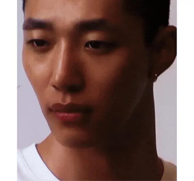 Gif of a man wearing a white shirt