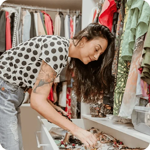 woman in house organizing someone's closet woman in house organizing someone's closet