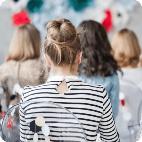 a woman from behind wearing a bun, one of our favorite easy hair ideas a woman from behind wearing a bun, one of our favorite easy hair ideas