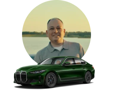 Man's photo adjacent to a green BMW i4.