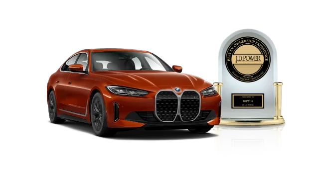 Engraved J.D. Power Award. Forward shot of a red BMW i4.