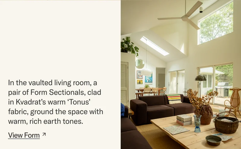 In the vaulted living room, a pair of Form Sectionals, clad in Kvadrat’s warm ‘Tonus’ fabric, ground the space with warm, rich earth tones.