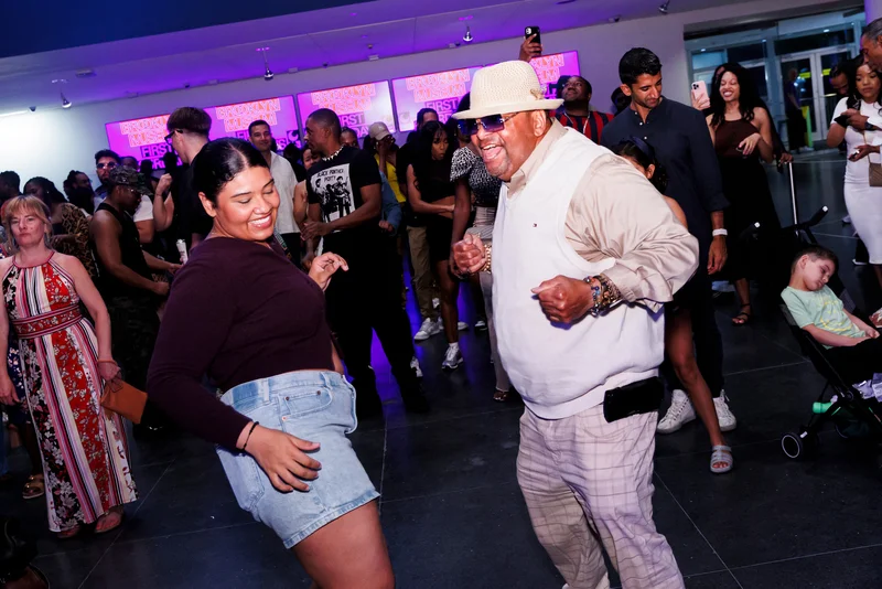 Visitors dancing in the lobby