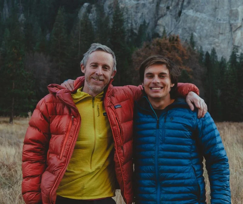 Two people standing in a meadow in Yosemite.