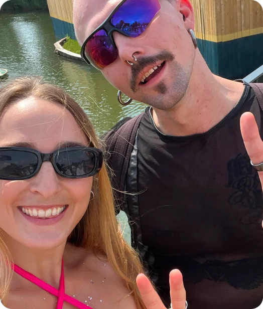 Two loyal Loopers making a peace sign wearing sunglasses
