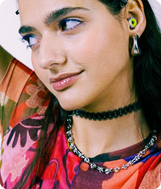 Woman wearing Loop Kinetic earplugs