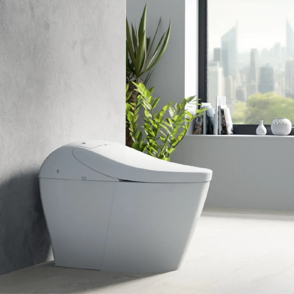 A TOTO WASHLET G5A in a modern bathroom beside a window overlooking a city