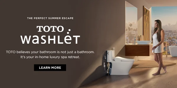 A woman is walking toward a TOTO WASHLET in a luxury bathroom.