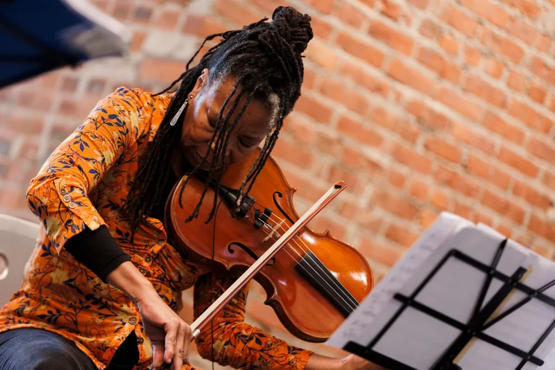 A woman playing the violin