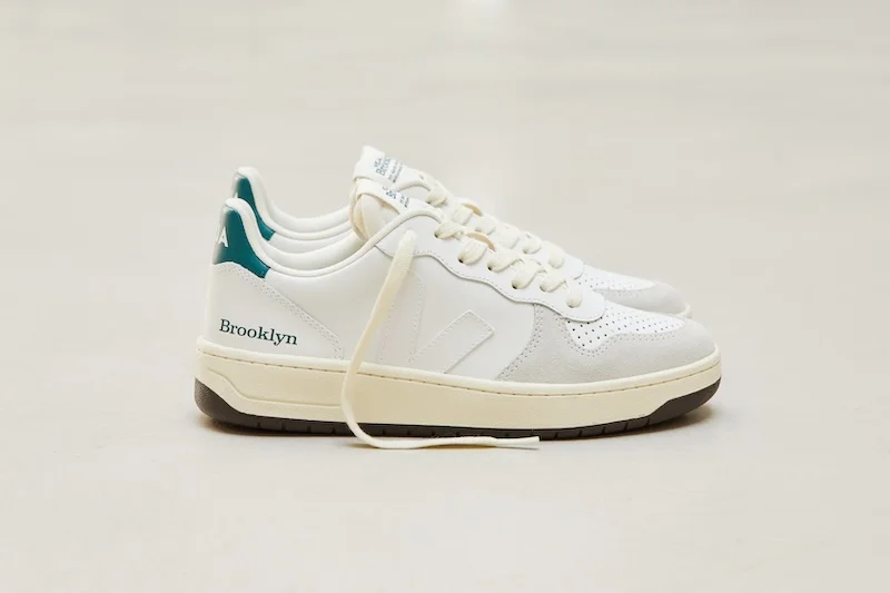White sneakers that say “Brooklyn” at the heel