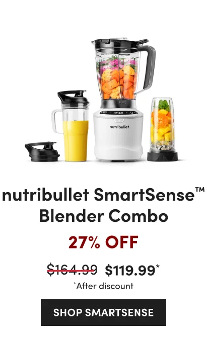 A nutribullet blender set with a black base, filled with fresh fruits and vegetables with a yellow smoothie cup and a cup with orange fruits.