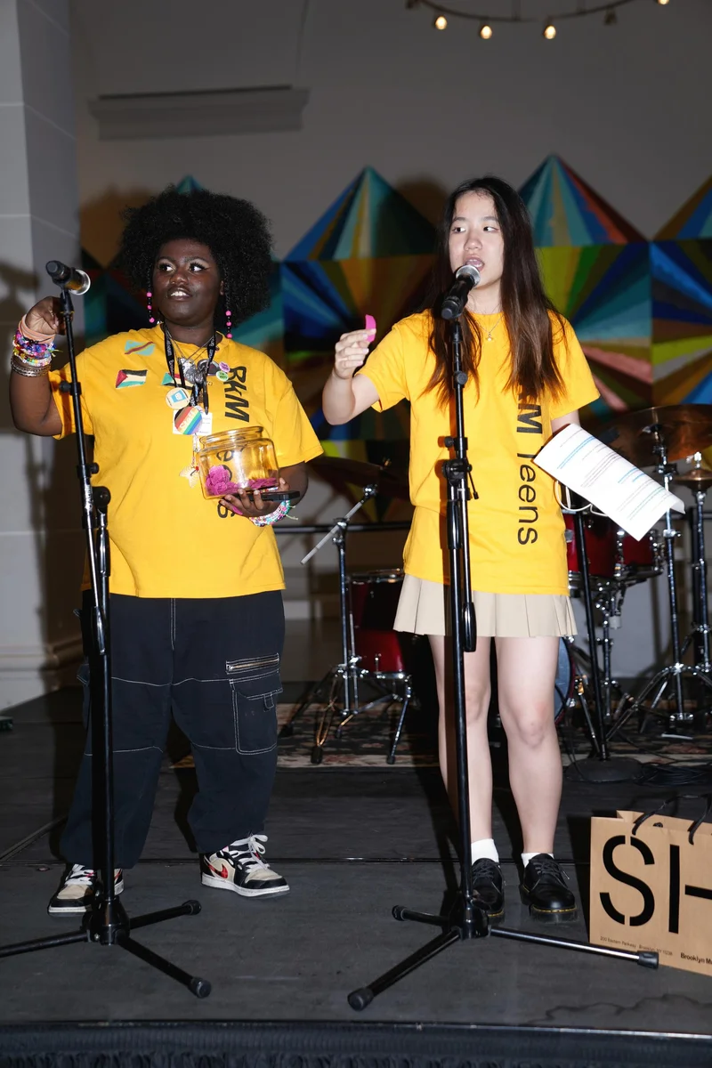 Teens performing at microphones