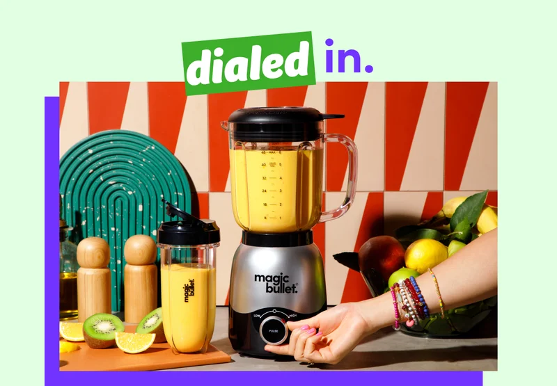 Woman blending a fruit smoothie in the magic bullet Blender