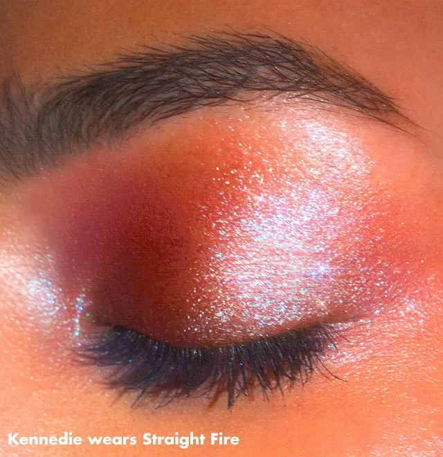 Model wearing Fine as fleck glitter eyeshadow in shade straight fire Model wearing Fine as fleck glitter eyeshadow in shade straight fire