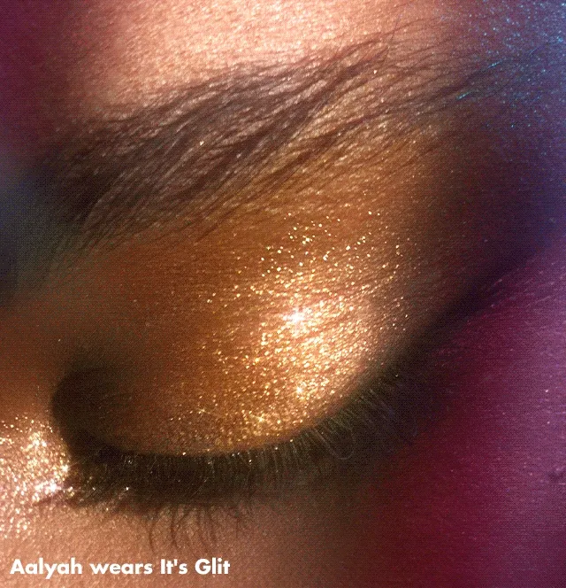 Model wearing Fine as fleck glitter eyeshadow in shade it's gilt Model wearing Fine as fleck glitter eyeshadow in shade it's gilt