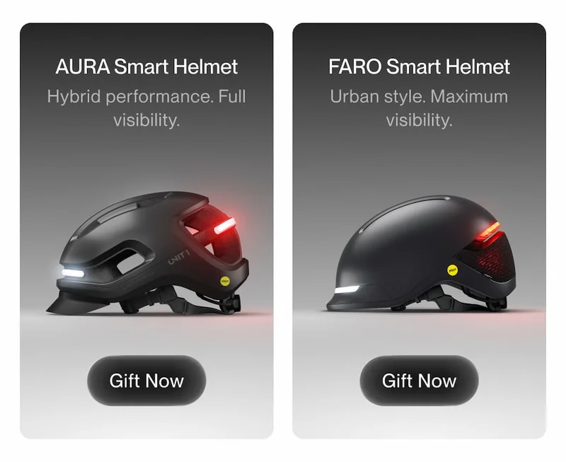 Side-by-side product cards showing UNIT 1 AURA Smart Helmet and FARO Smart Helmet with integrated front and rear lights, short descriptions highlighting performance and visibility, and “Gift Now” buttons.