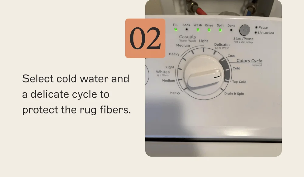 Select cold water and a delicate cycle to protect the rug fibers.
