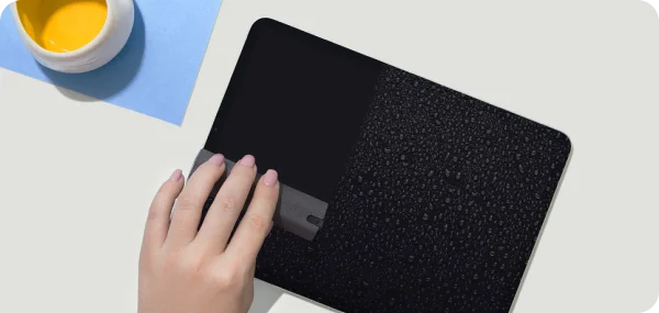 The cleaning kit in use on an iPad.